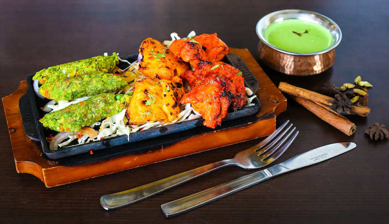 The Song of India signature dishes Sufiyani Chicken Dum BriyaniMalai Chicken TikkaKashmiri Lamb Rack